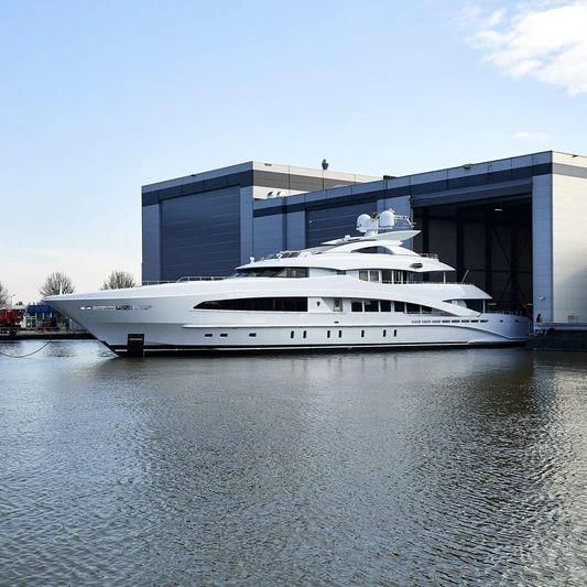 a large white yacht in a body of water aboard DAISY D Yacht for Sale
