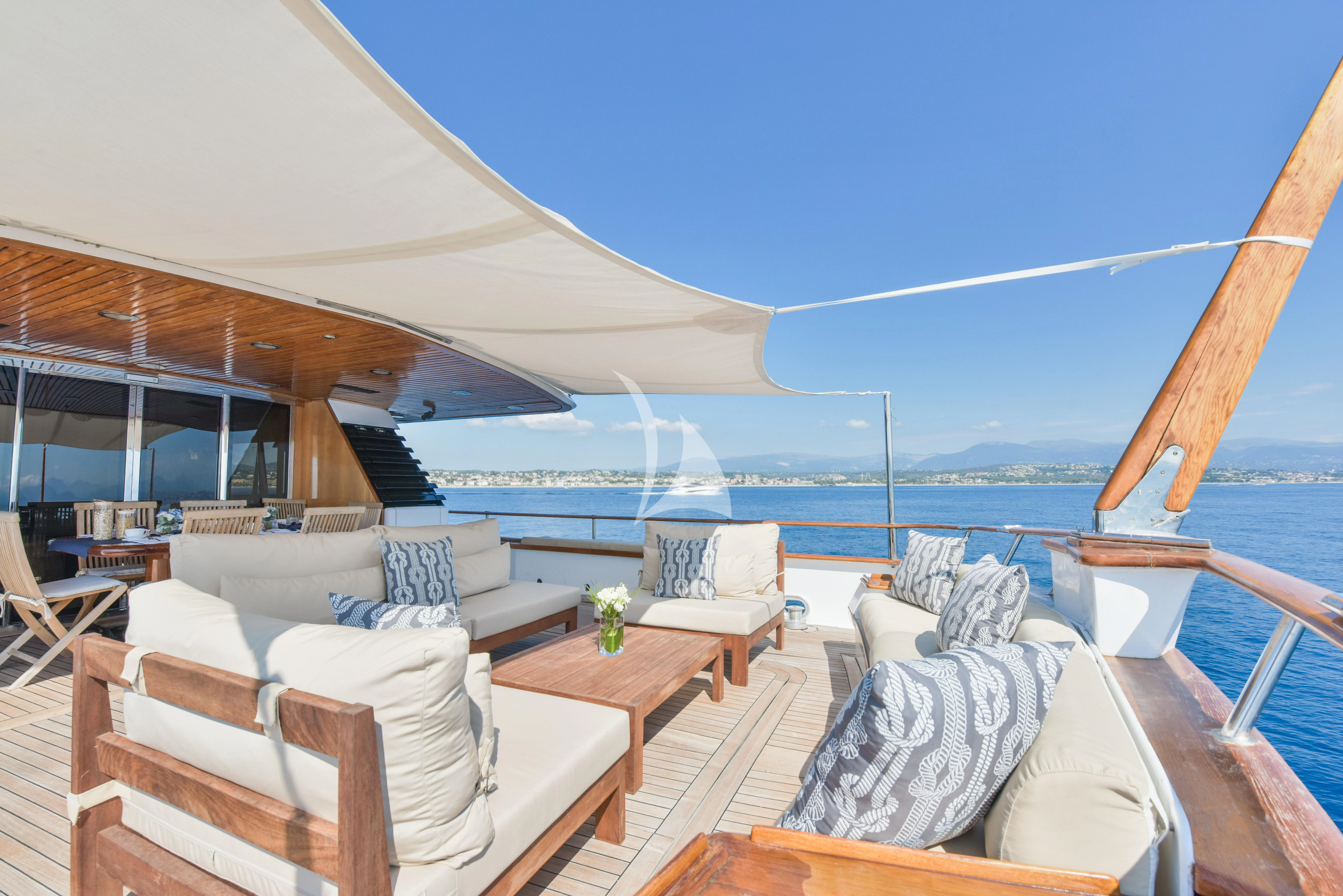 a room with a view of the ocean and a large cruise ship aboard ATLANTIC ENDEAVOUR Yacht for Charter