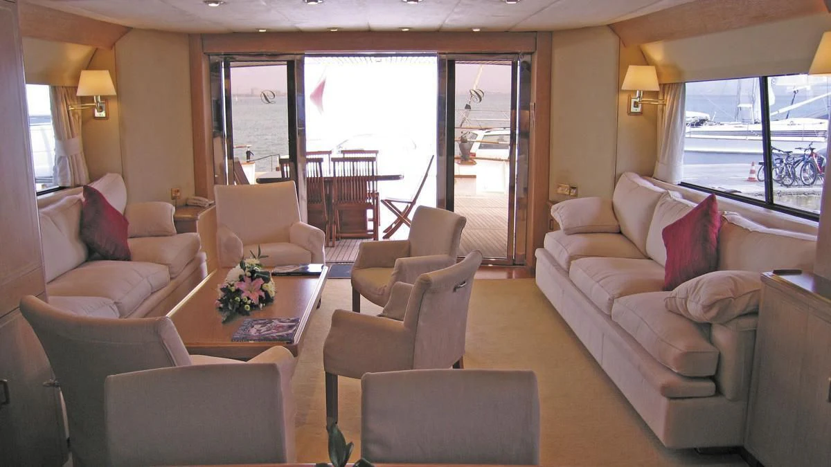 a living room with a large glass door aboard ATLANTIC ENDEAVOUR Yacht for Charter