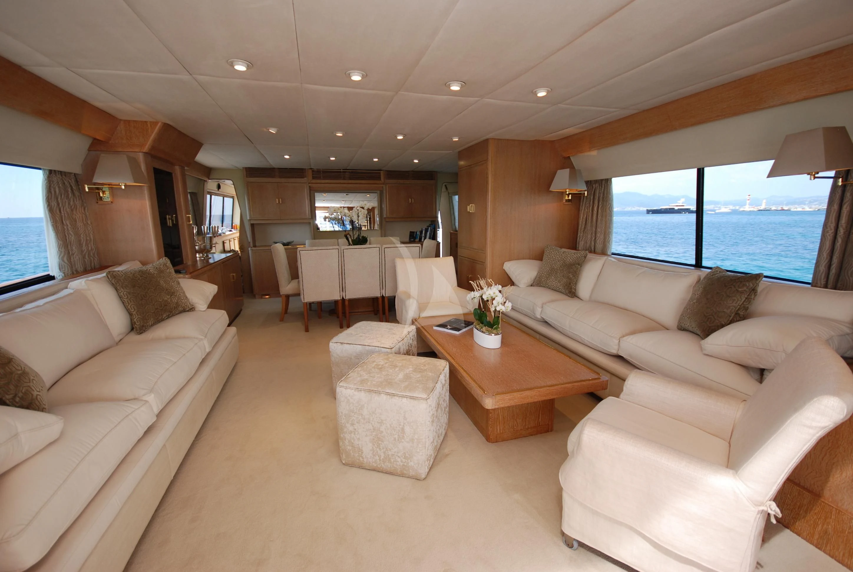 a living room with a large window aboard ATLANTIC ENDEAVOUR Yacht for Charter