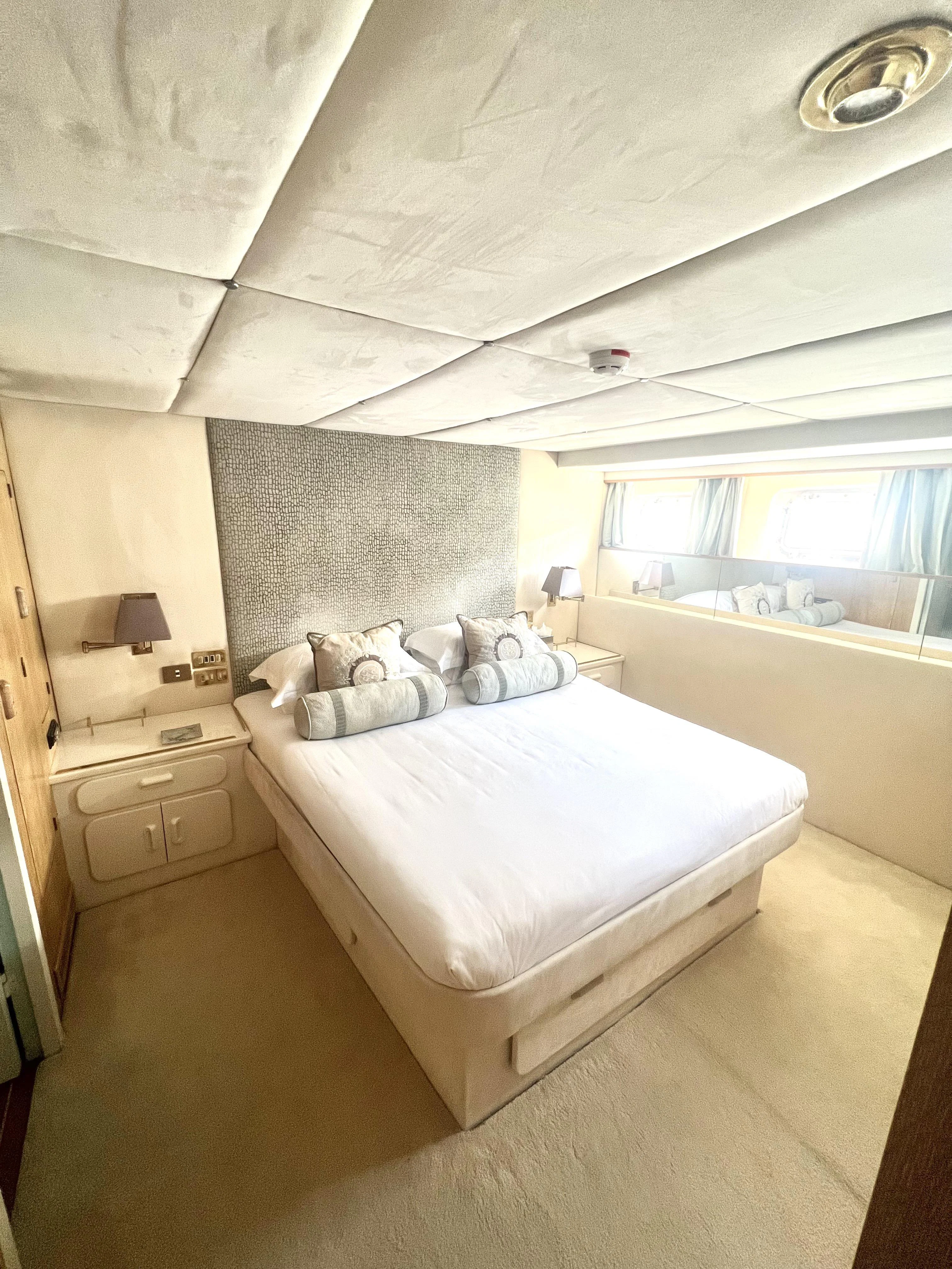 a bedroom with a large bed aboard ATLANTIC ENDEAVOUR Yacht for Charter