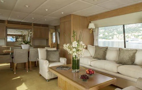 a living room with a couch and a table aboard ATLANTIC ENDEAVOUR Yacht for Charter