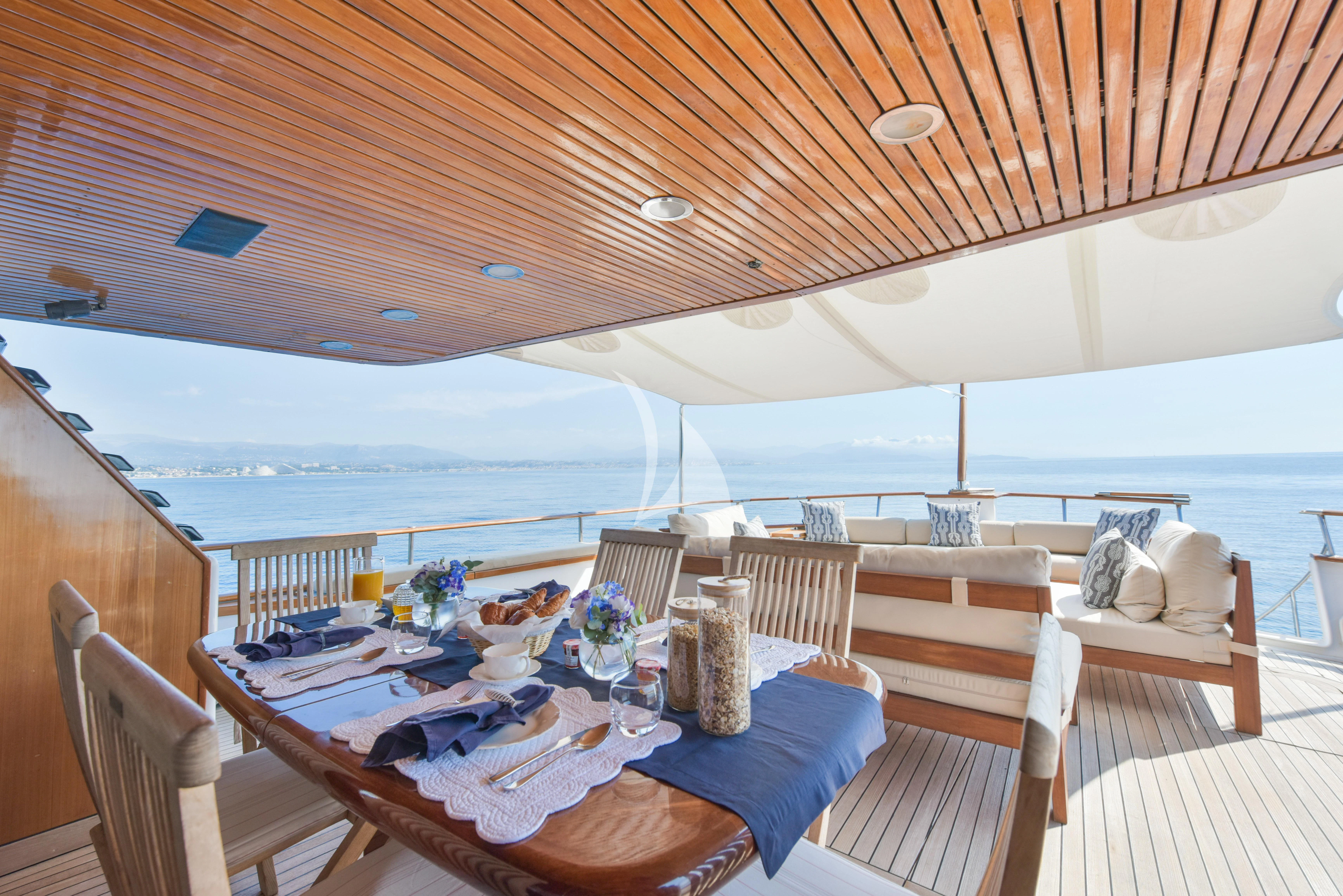 a table on a deck aboard ATLANTIC ENDEAVOUR Yacht for Charter