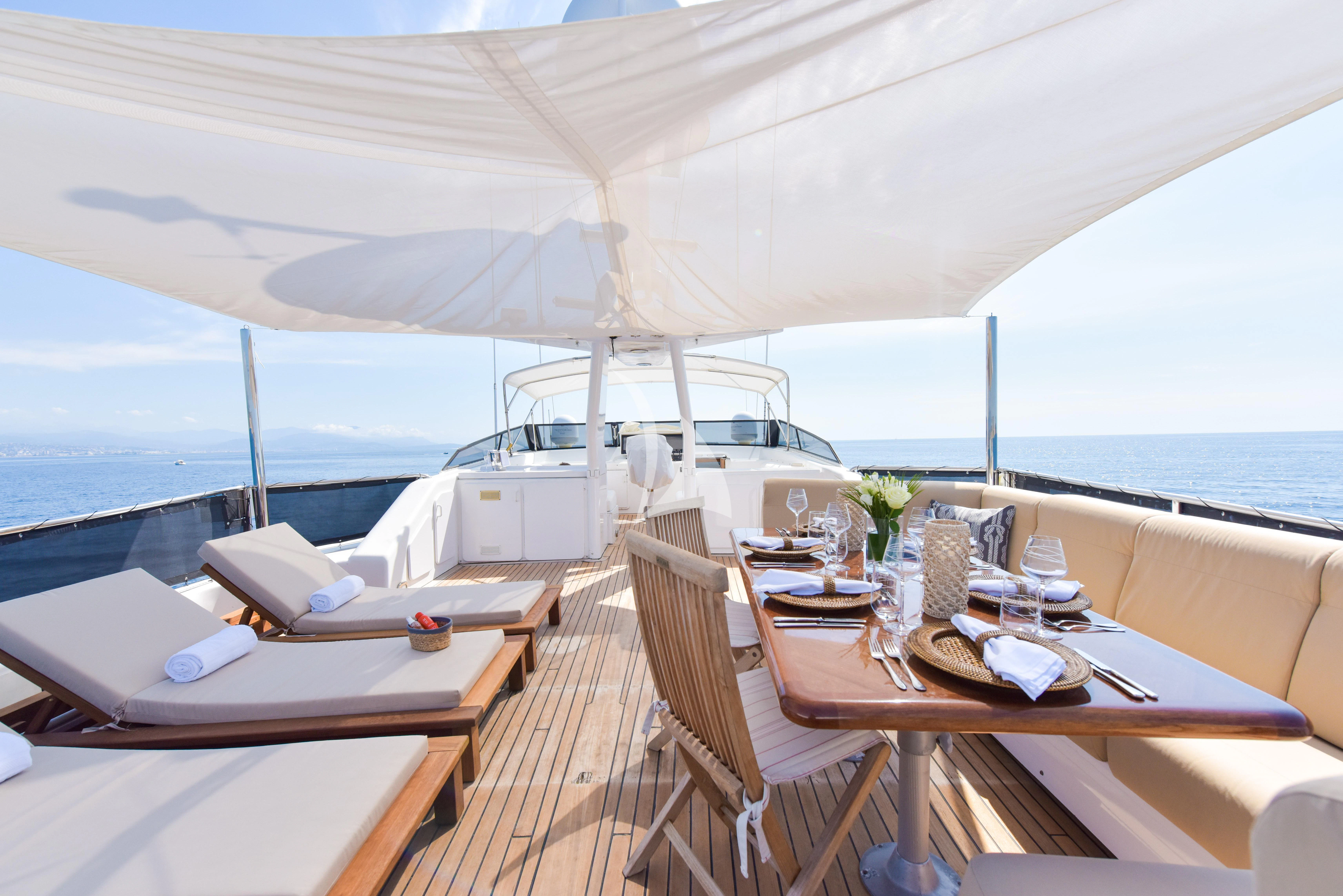 a table and chairs on a boat aboard ATLANTIC ENDEAVOUR Yacht for Charter