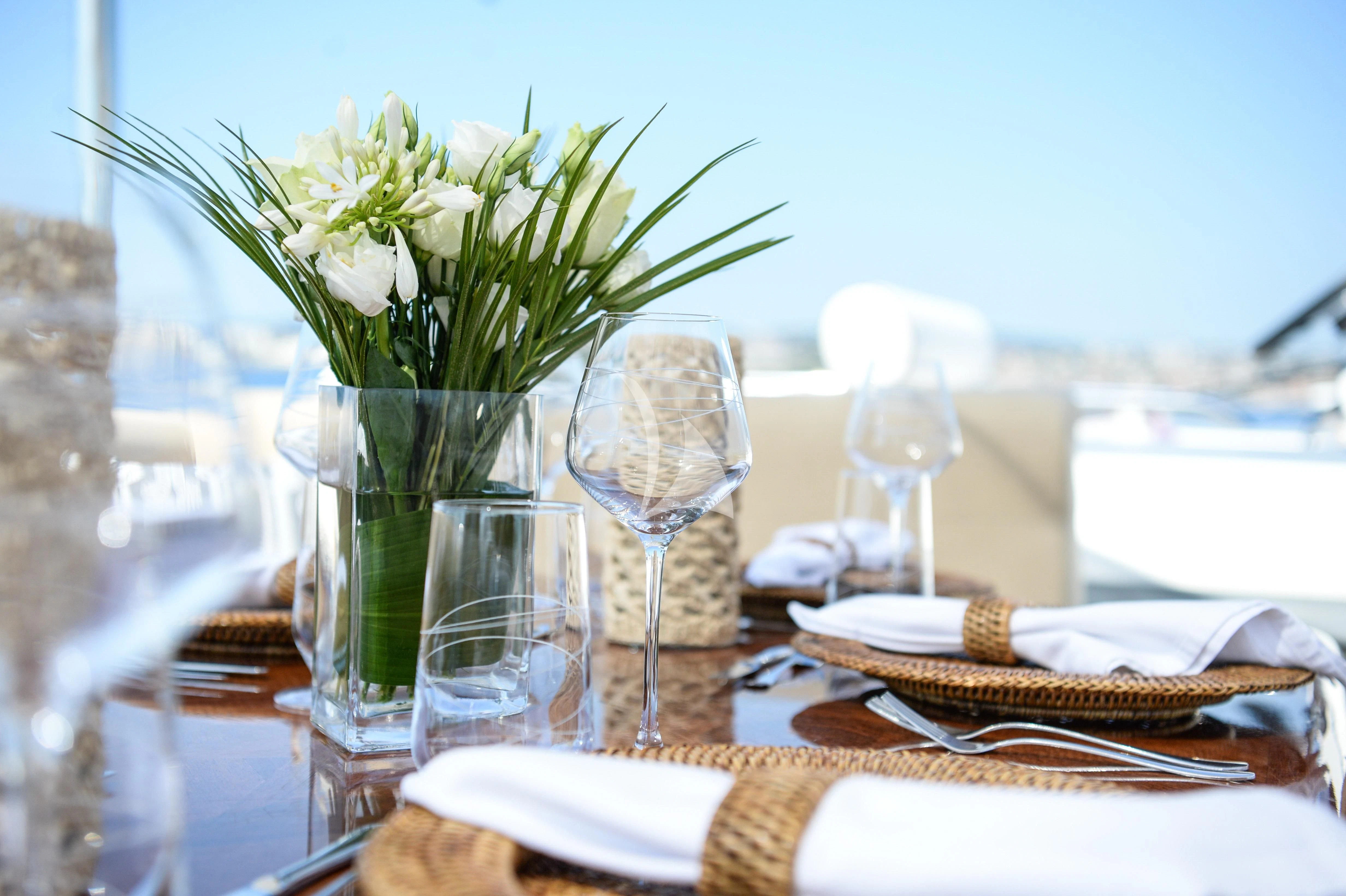 a vase of flowers on a table aboard ATLANTIC ENDEAVOUR Yacht for Charter
