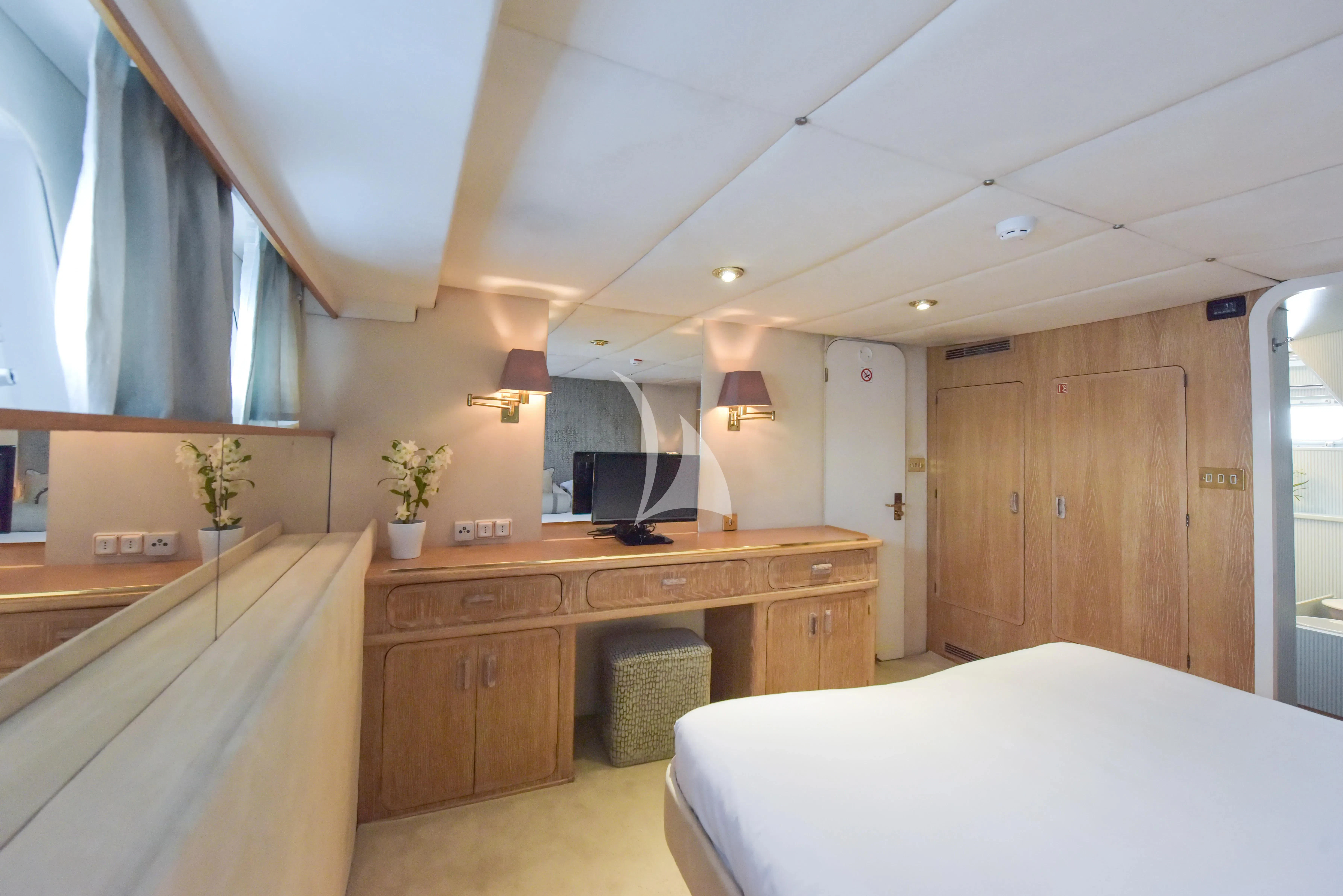 a bedroom with a large bed aboard ATLANTIC ENDEAVOUR Yacht for Charter