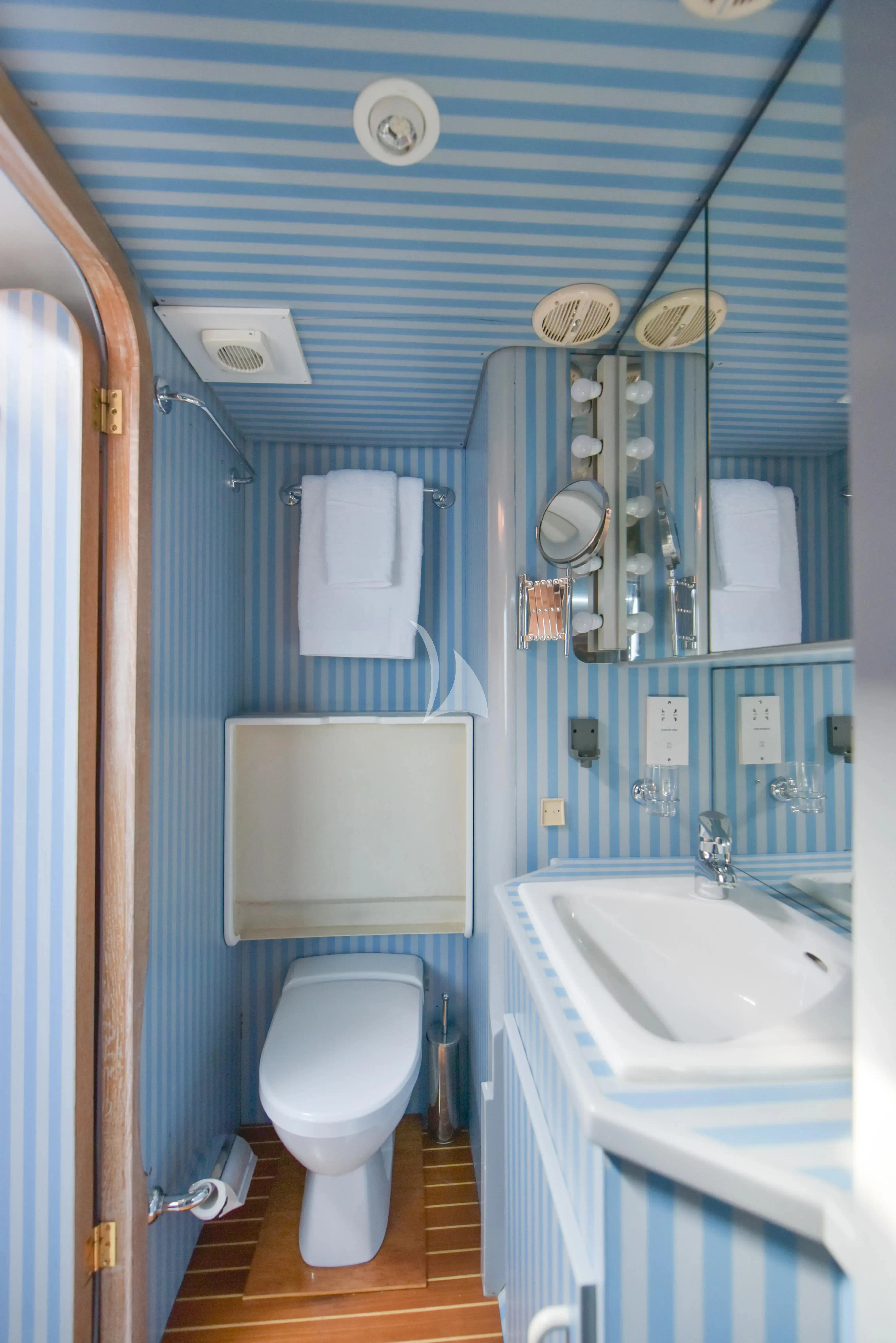 a bathroom with a toilet and sink aboard ATLANTIC ENDEAVOUR Yacht for Charter