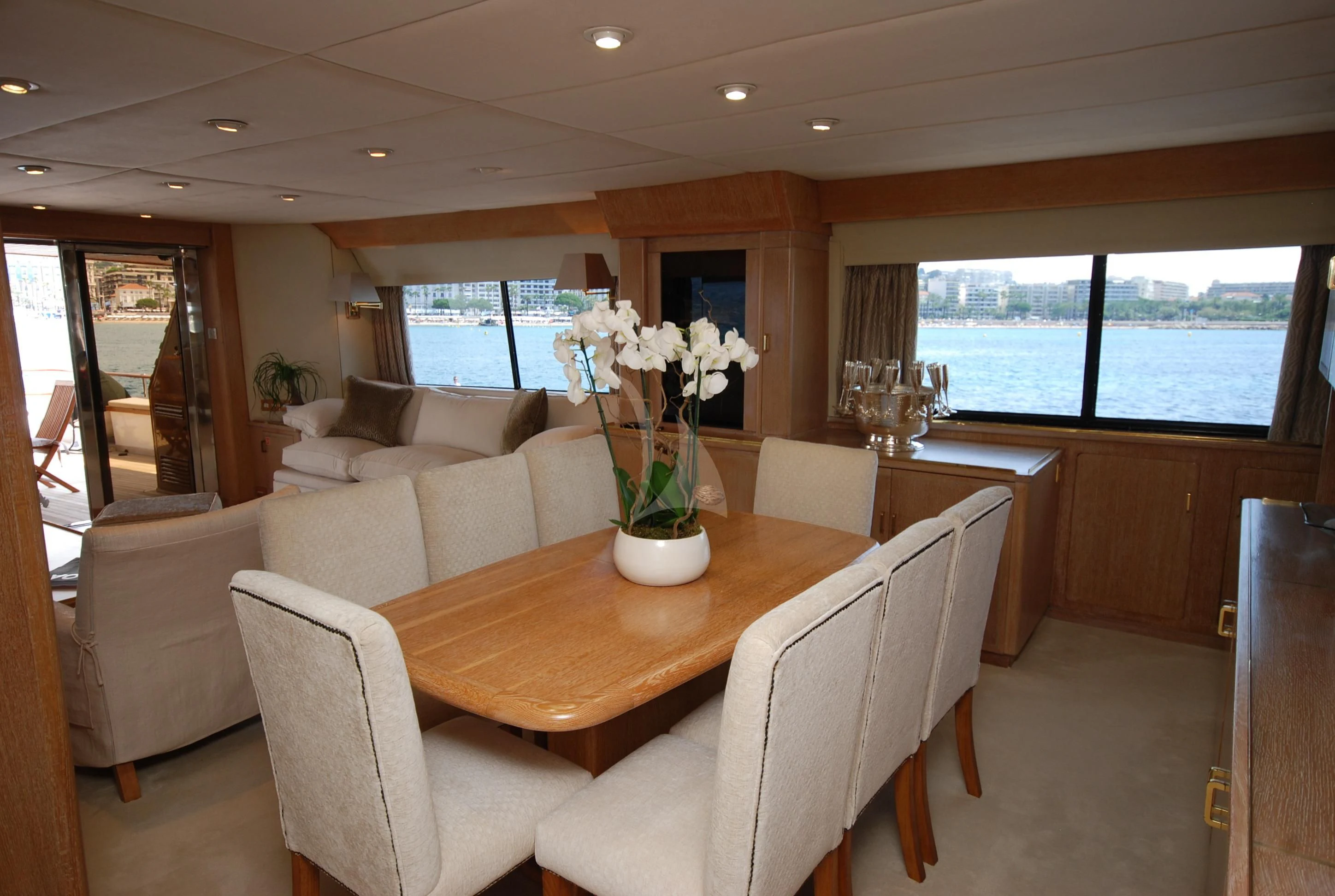 a living room with a table and chairs aboard ATLANTIC ENDEAVOUR Yacht for Charter