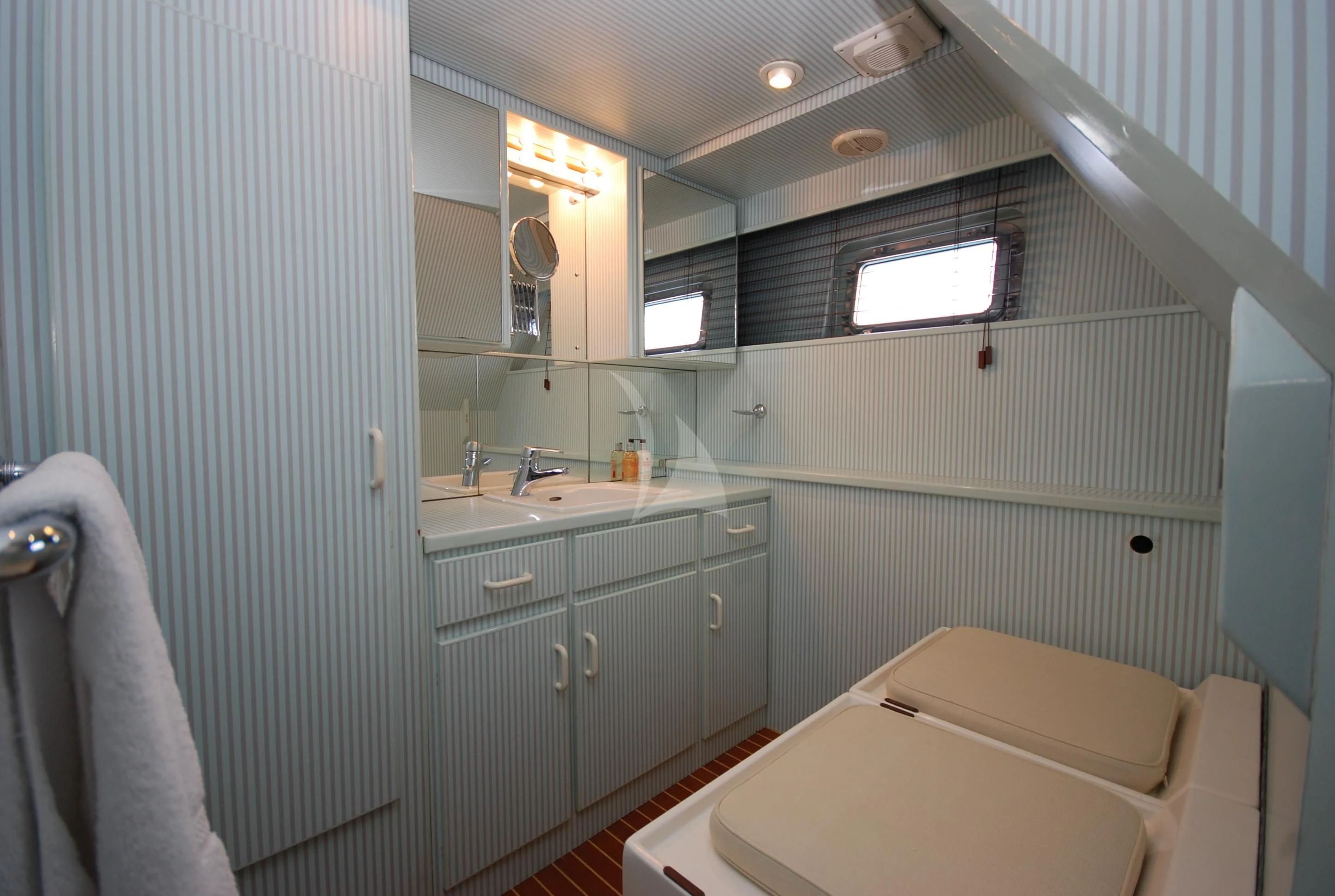 a bathroom with a sink and a bathtub aboard ATLANTIC ENDEAVOUR Yacht for Charter