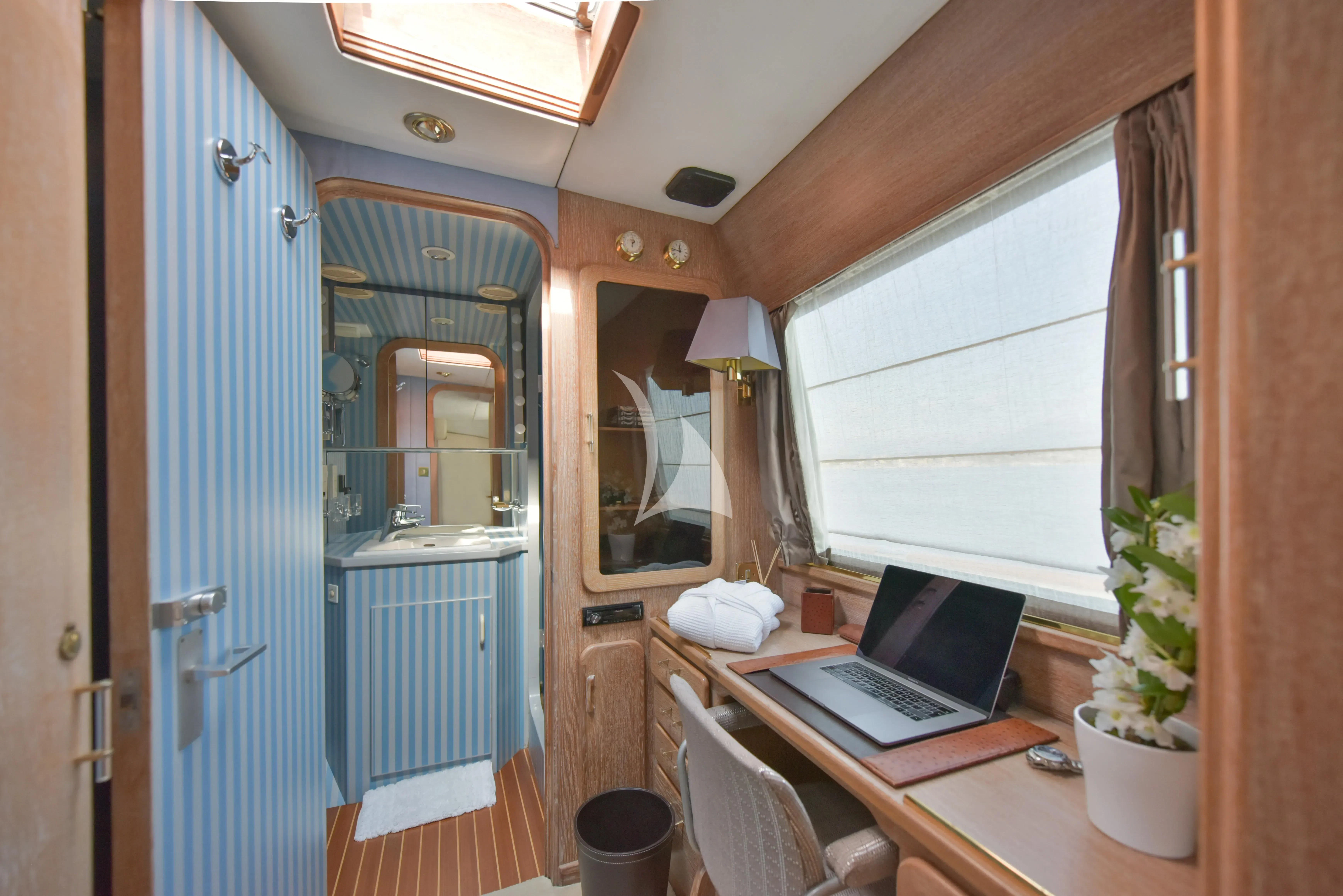 a laptop on a desk aboard ATLANTIC ENDEAVOUR Yacht for Charter