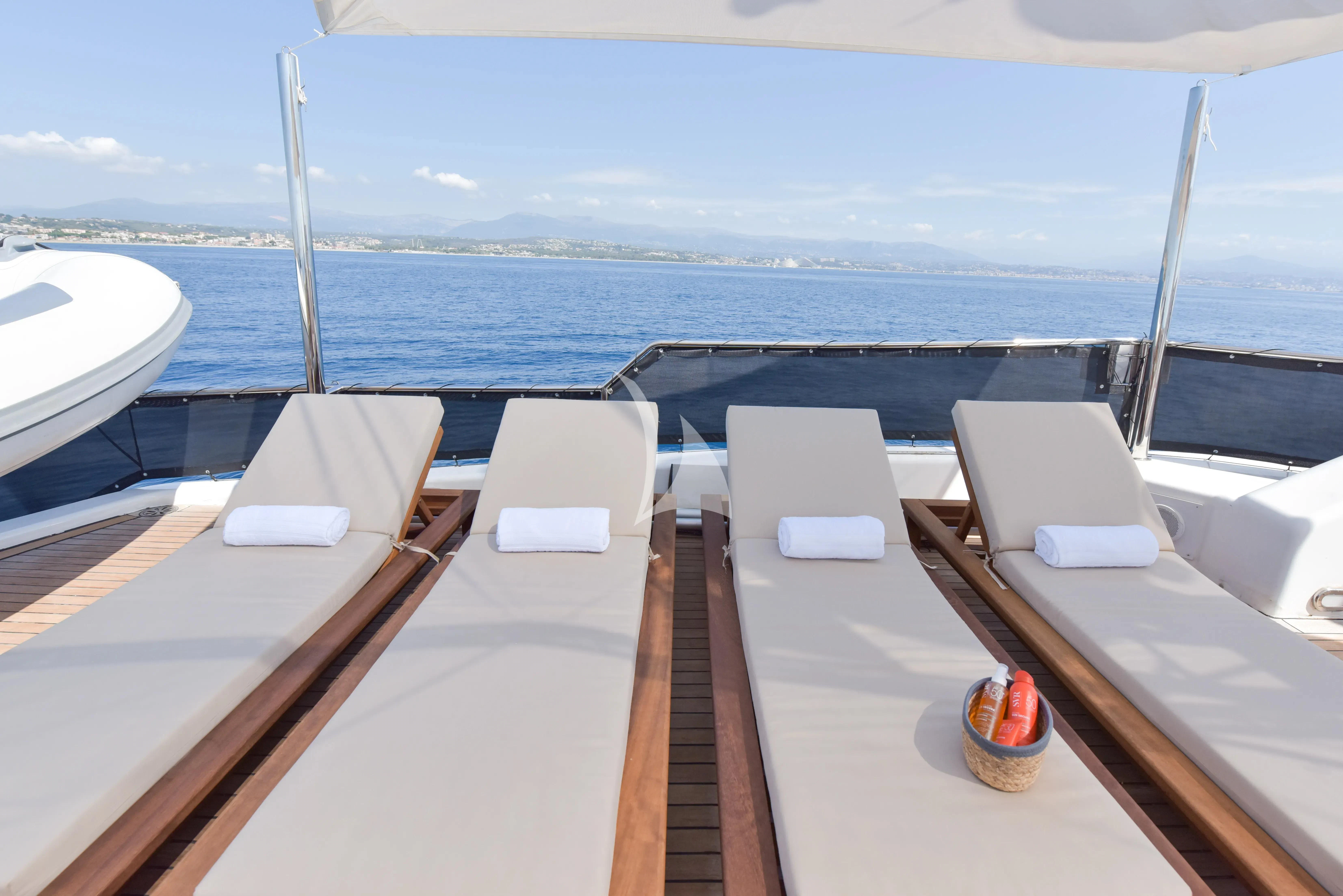 a deck with chairs and a table on it aboard ATLANTIC ENDEAVOUR Yacht for Charter