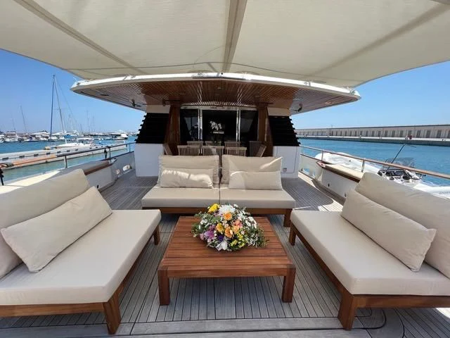 a living room with a large balcony overlooking the ocean aboard ATLANTIC ENDEAVOUR Yacht for Charter