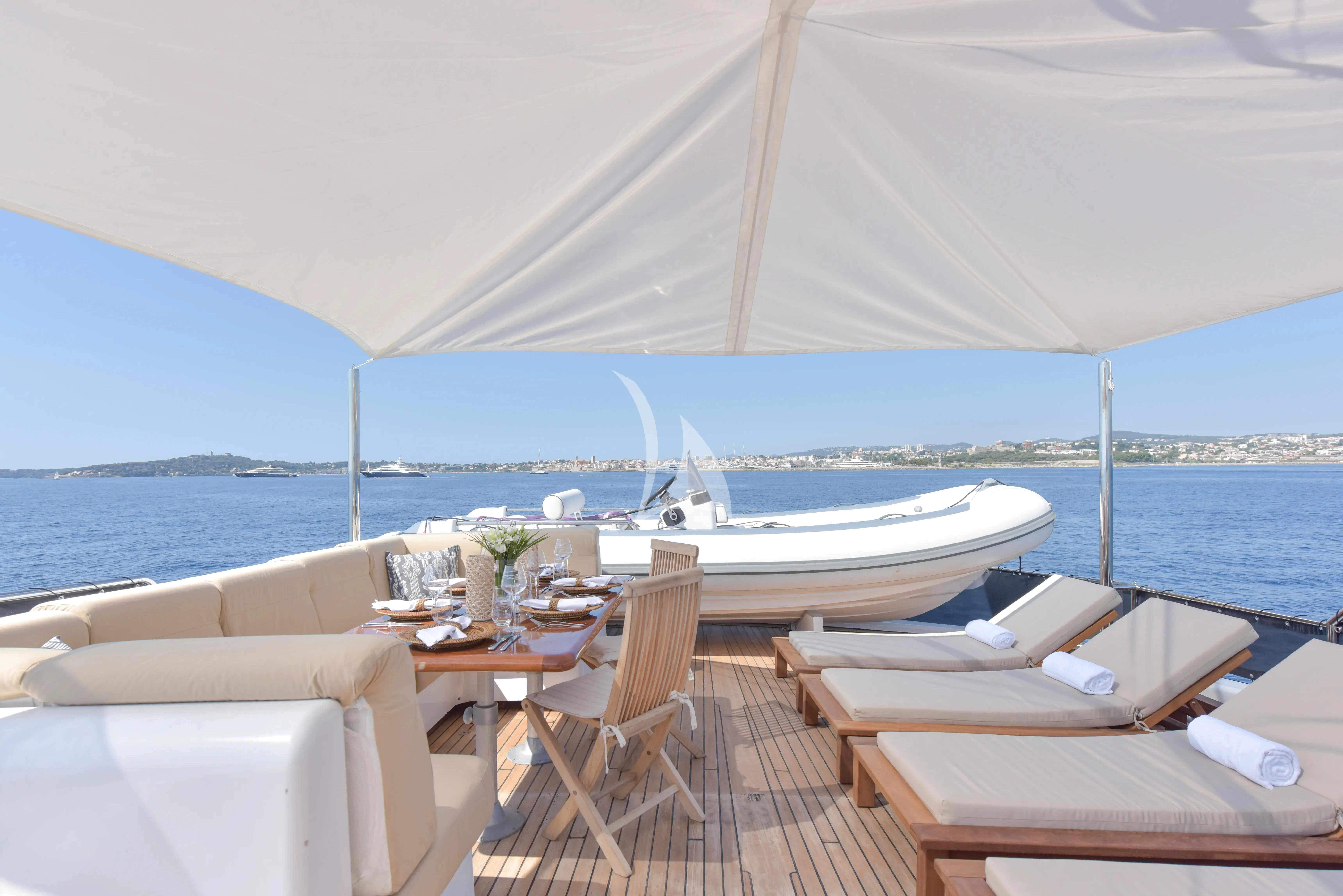 a table and chairs on a boat aboard ATLANTIC ENDEAVOUR Yacht for Charter