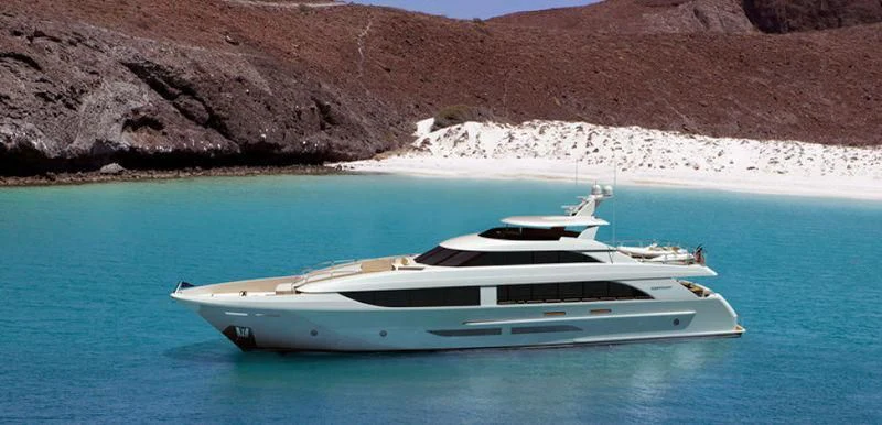 a white boat in the water aboard LION'S DEN Yacht for Sale