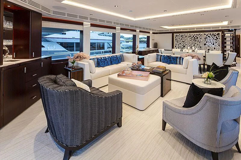 a living room with a couch and a table aboard LION'S DEN Yacht for Sale