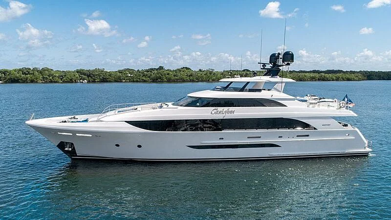 a white yacht on the water aboard LION'S DEN Yacht for Sale