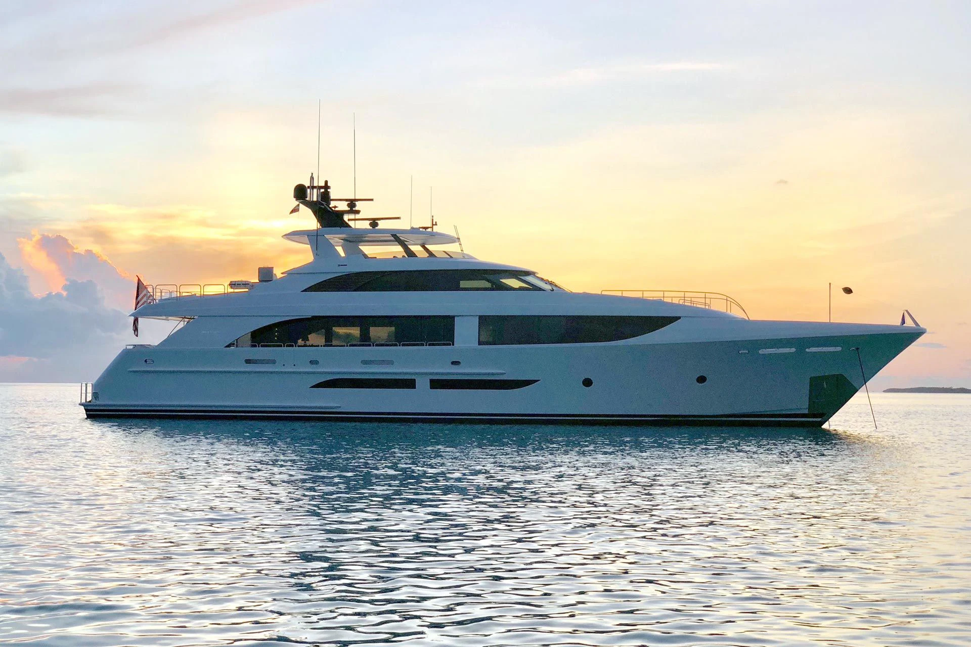 a white yacht on the water aboard LION'S DEN Yacht for Sale