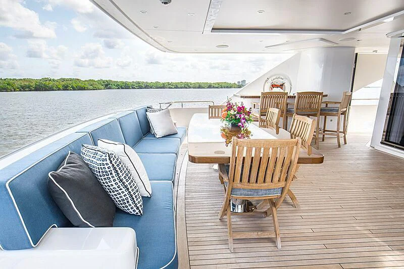 a living room with a couch and a table and chairs aboard LION'S DEN Yacht for Sale