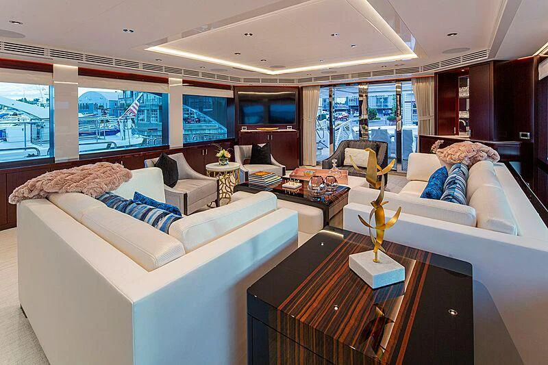 a living room with a couch and a coffee table aboard LION'S DEN Yacht for Sale