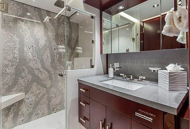 a bathroom with a countertop sink and a mirror aboard LION'S DEN Yacht for Sale