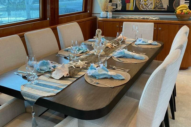 a dining table set for a dinner aboard SLIPAWAY Yacht for Sale