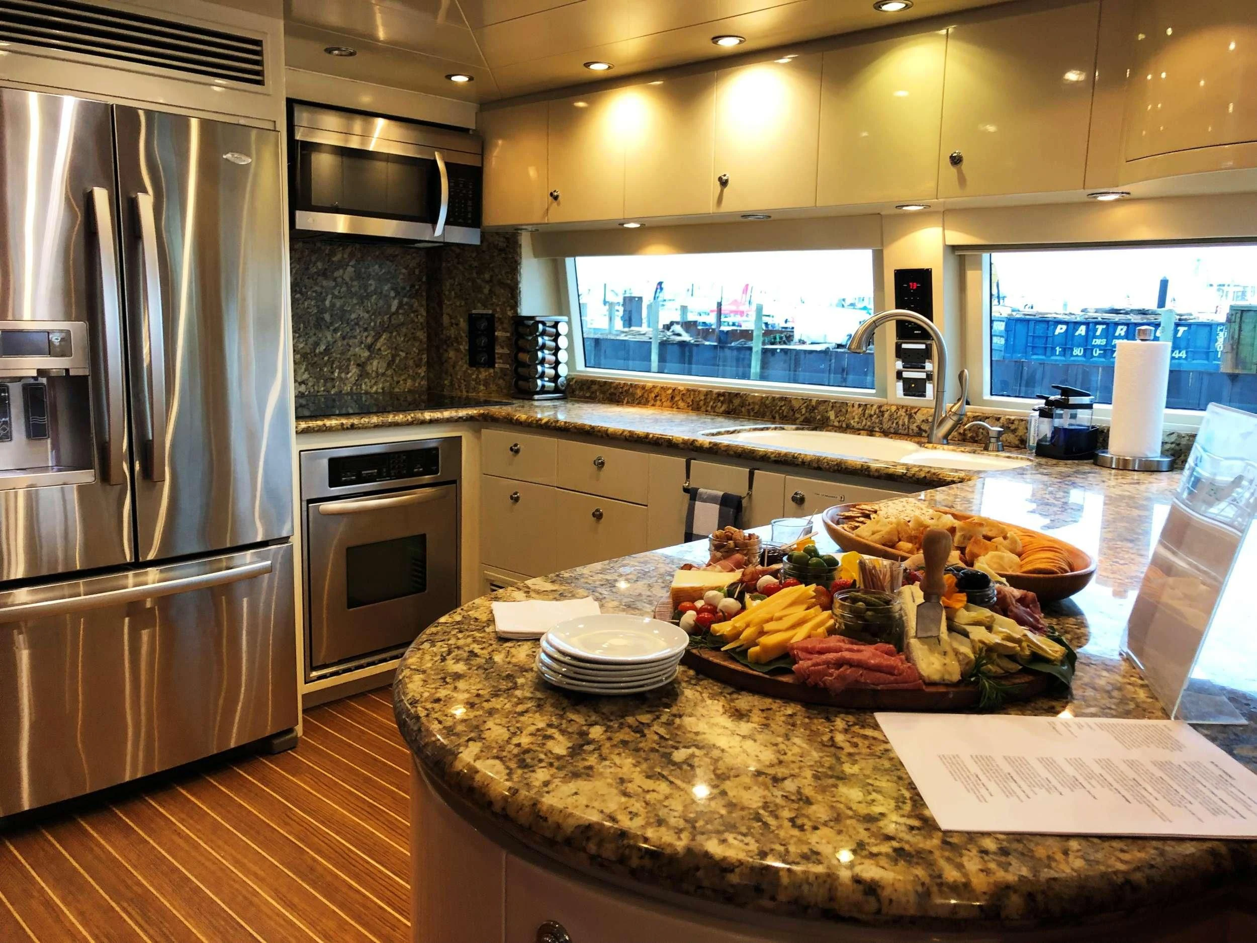 a kitchen with a large island aboard SLIPAWAY Yacht for Sale