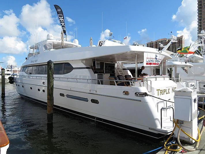 a large white boat docked aboard SLIPAWAY Yacht for Sale