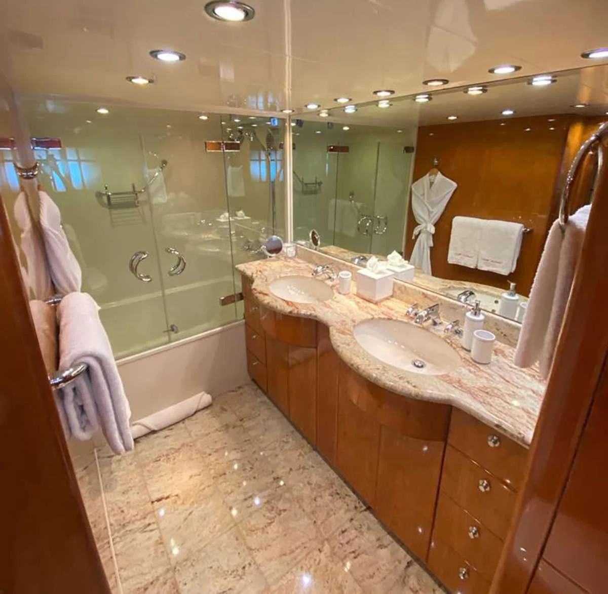 a bathroom with a large mirror aboard SLIPAWAY Yacht for Sale