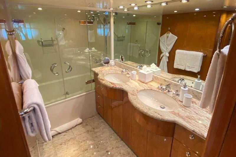 a bathroom with a large glass shower aboard SLIPAWAY Yacht for Sale