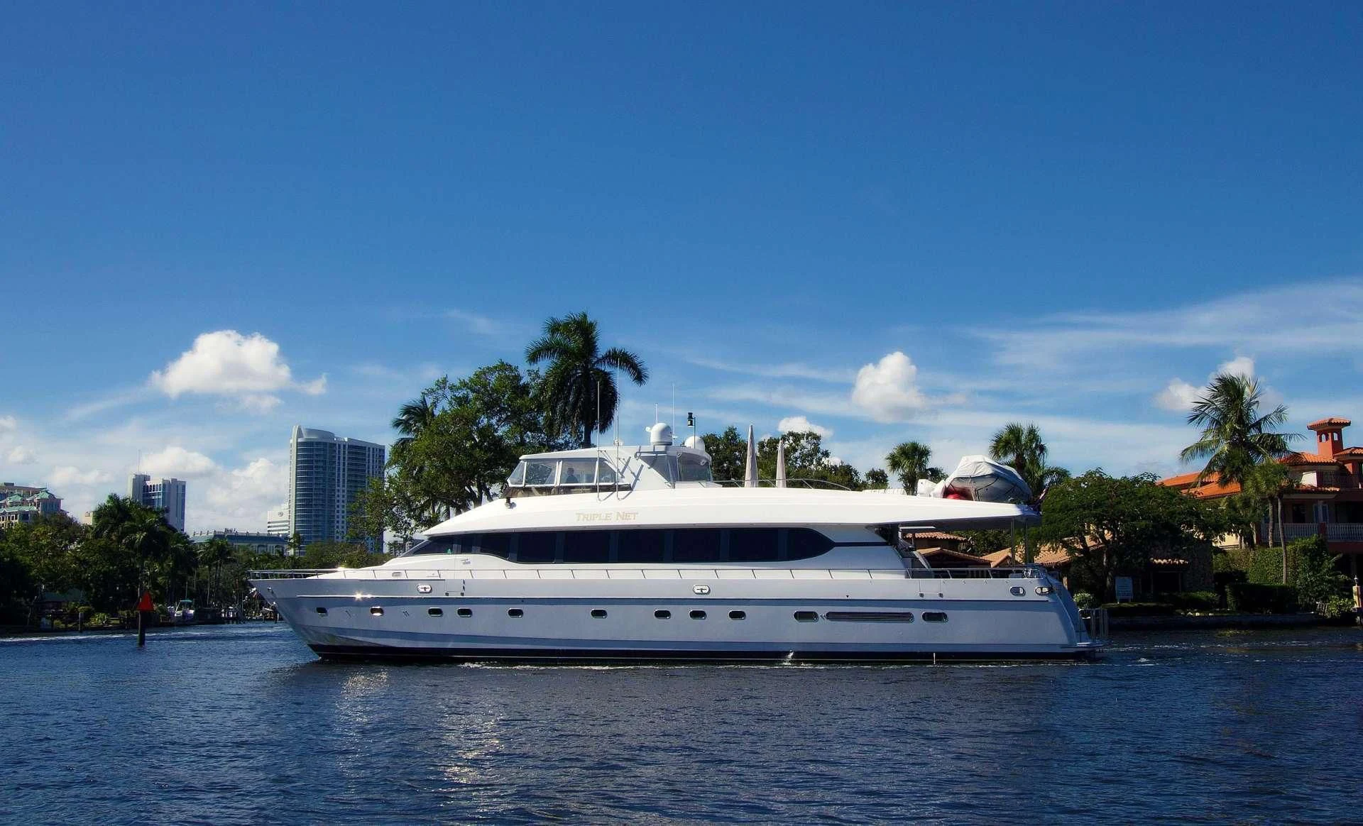 a white boat on water aboard SLIPAWAY Yacht for Sale