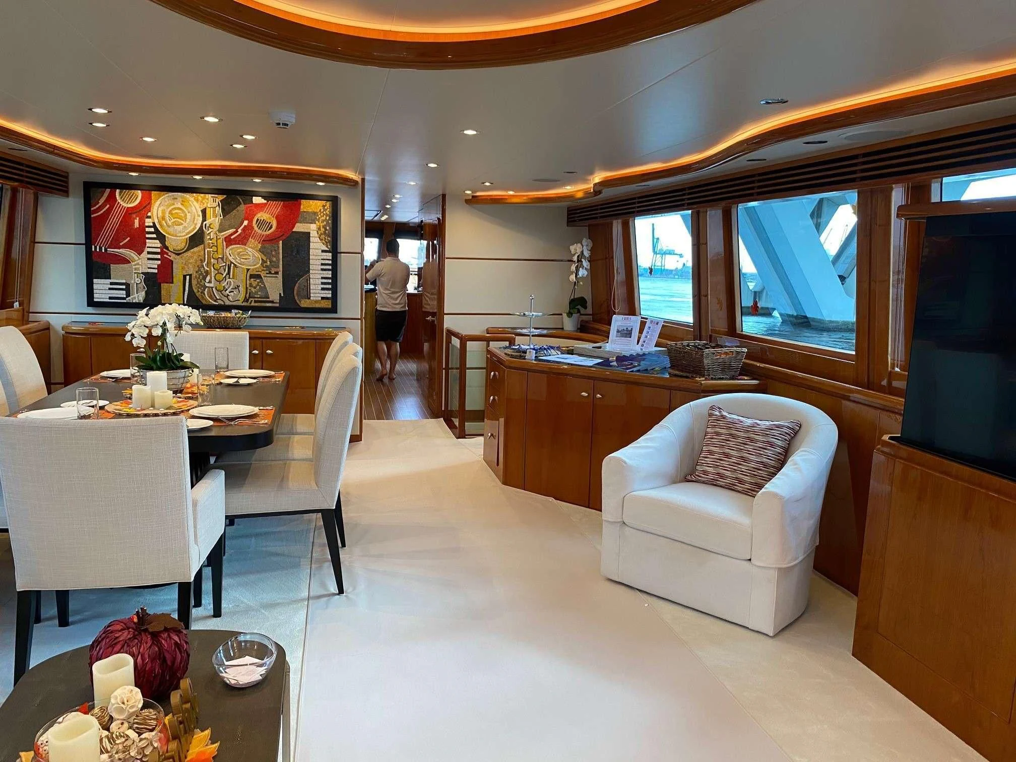 a room with a table chairs and a person standing in the doorway aboard SLIPAWAY Yacht for Sale