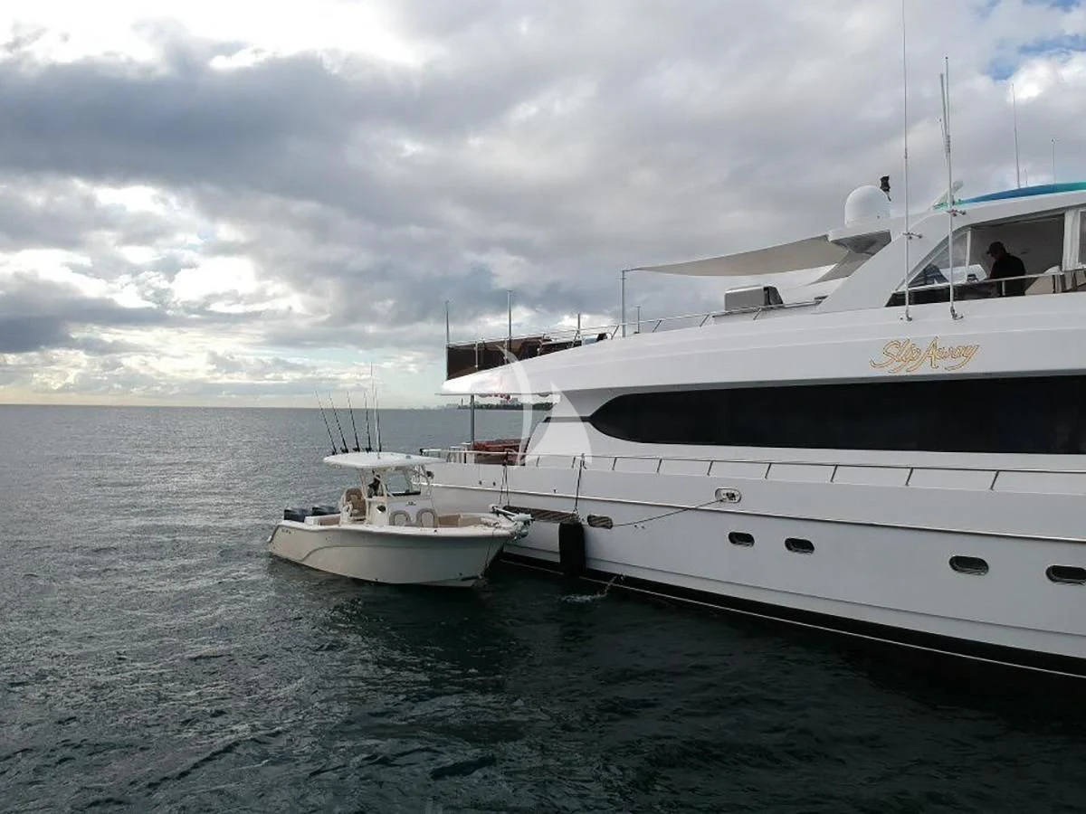 a couple of white boats in the water aboard SLIPAWAY Yacht for Sale