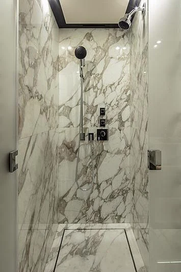 a shower with a shower head aboard AGORA III Yacht for Sale