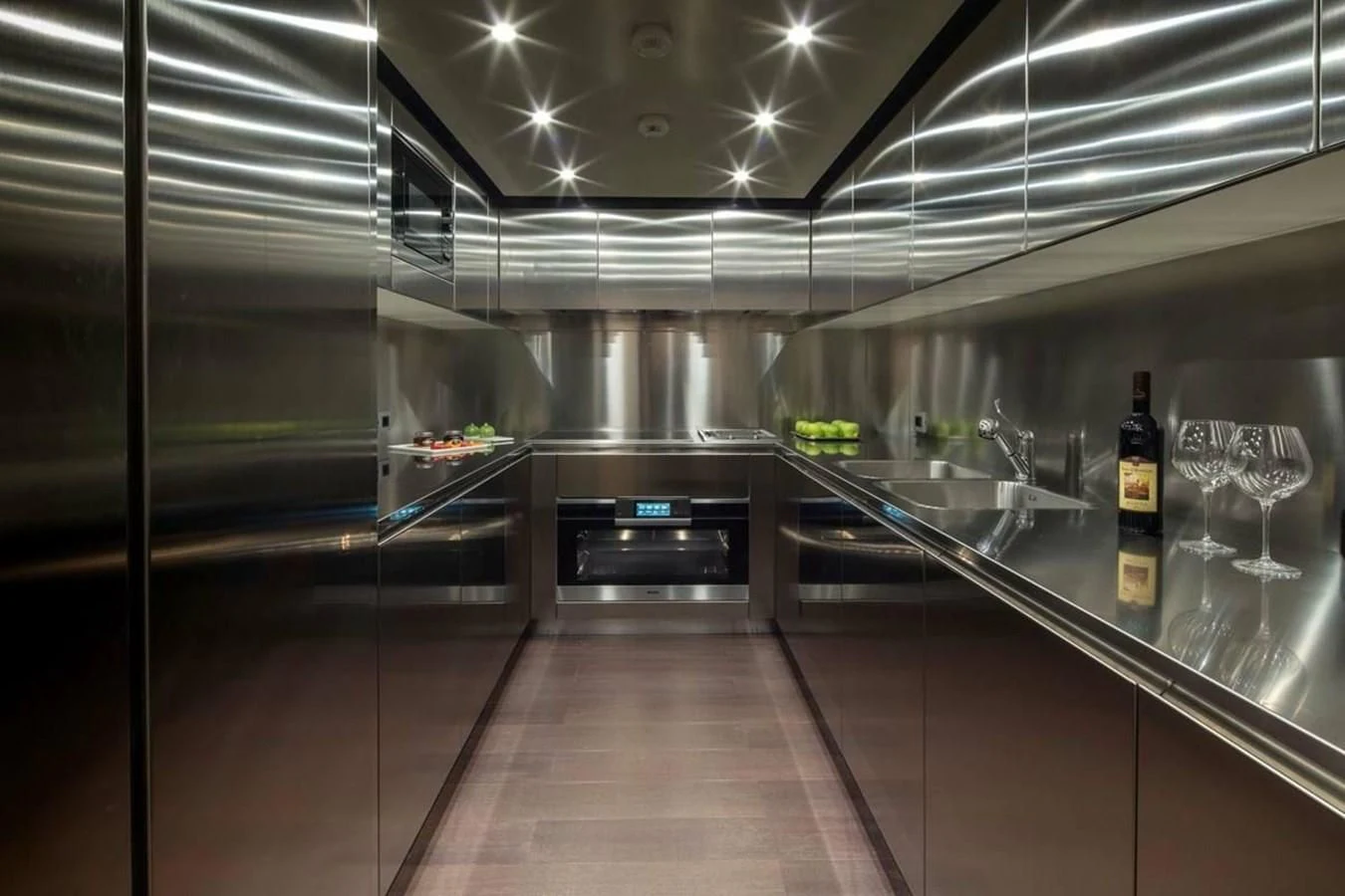 a large kitchen with stainless steel appliances aboard AGORA III Yacht for Sale