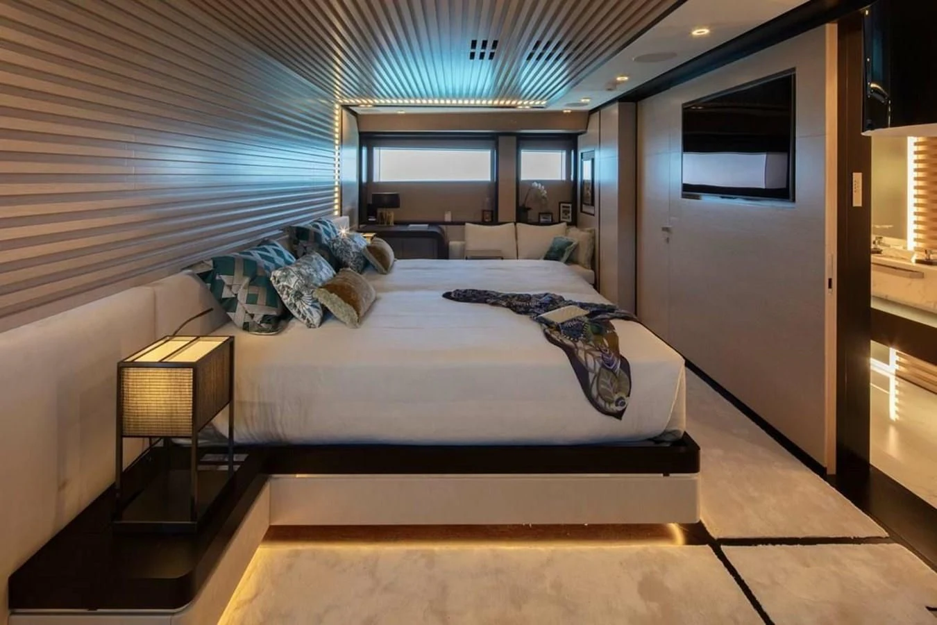 a room with a bed and a table aboard AGORA III Yacht for Sale