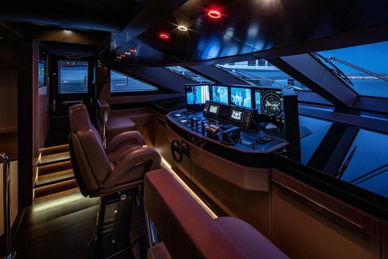 inside of a vehicle with a row of screens and seats aboard AGORA III Yacht for Sale
