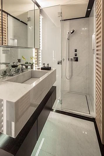 a bathroom with a shower and sink aboard AGORA III Yacht for Sale