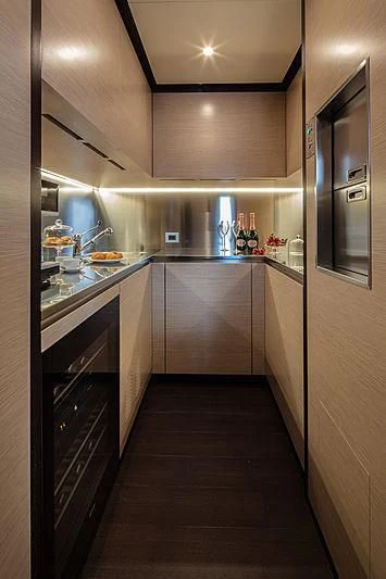 a kitchen with a wood floor aboard AGORA III Yacht for Sale