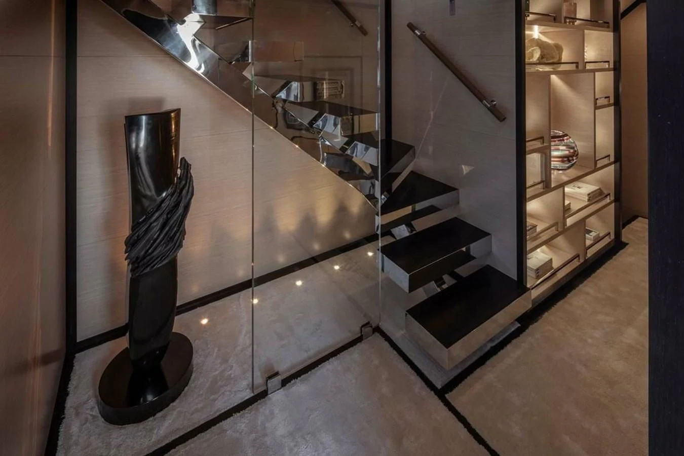 a black vase sits on a stand aboard AGORA III Yacht for Sale