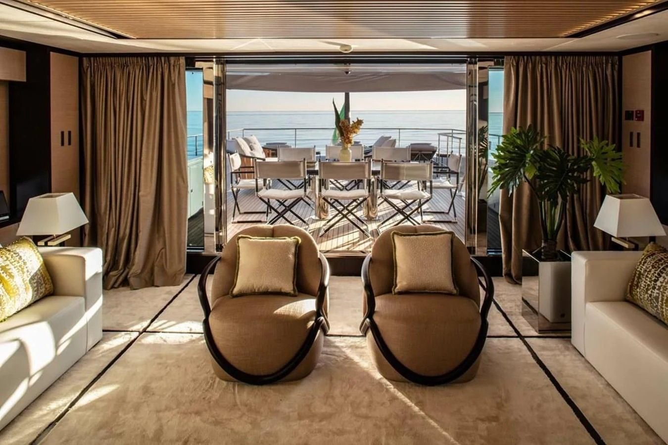 a living room with a large patio aboard AGORA III Yacht for Sale