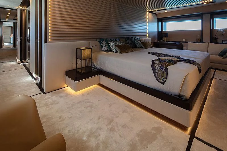 a bedroom with a bed aboard AGORA III Yacht for Sale