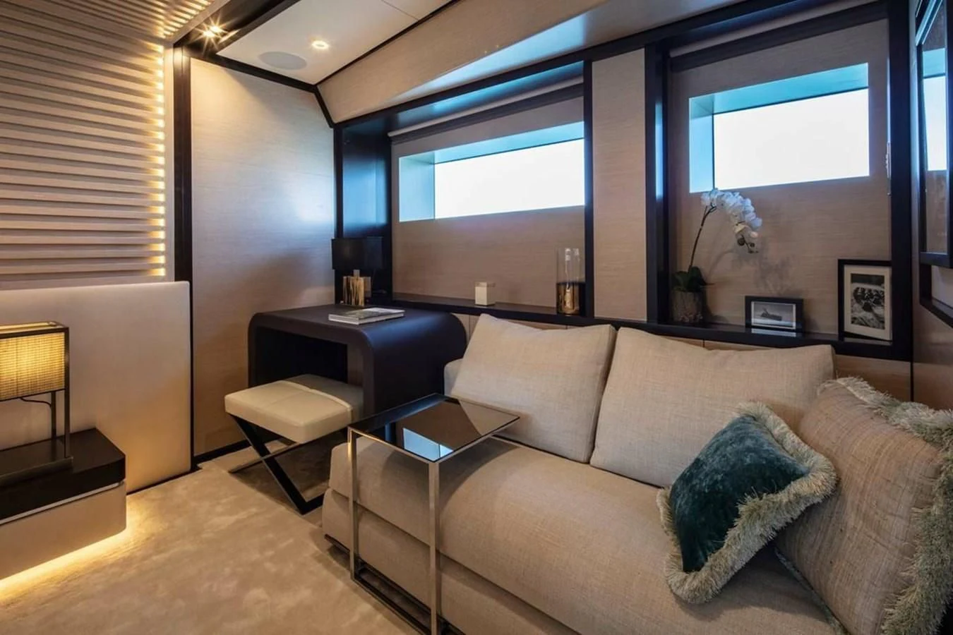 a living room with a couch and a table aboard AGORA III Yacht for Sale