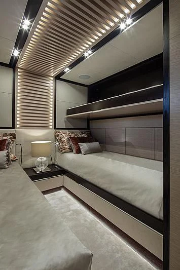 a modern bedroom with a large bed aboard AGORA III Yacht for Sale
