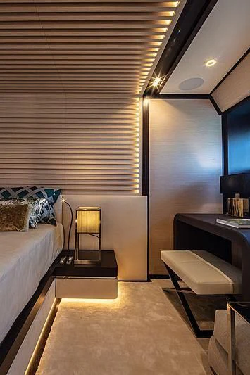 a room with a bed and a desk aboard AGORA III Yacht for Sale