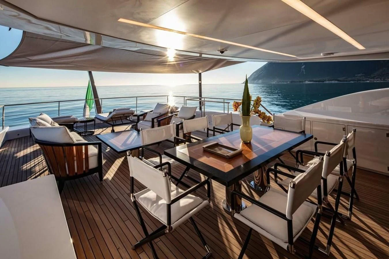 a room with a table and chairs aboard AGORA III Yacht for Sale