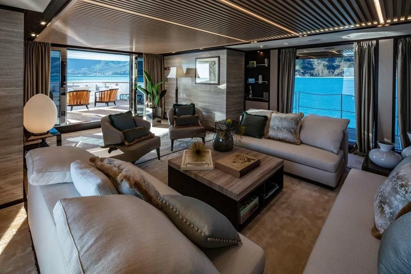 a living room with a large window aboard AGORA III Yacht for Sale