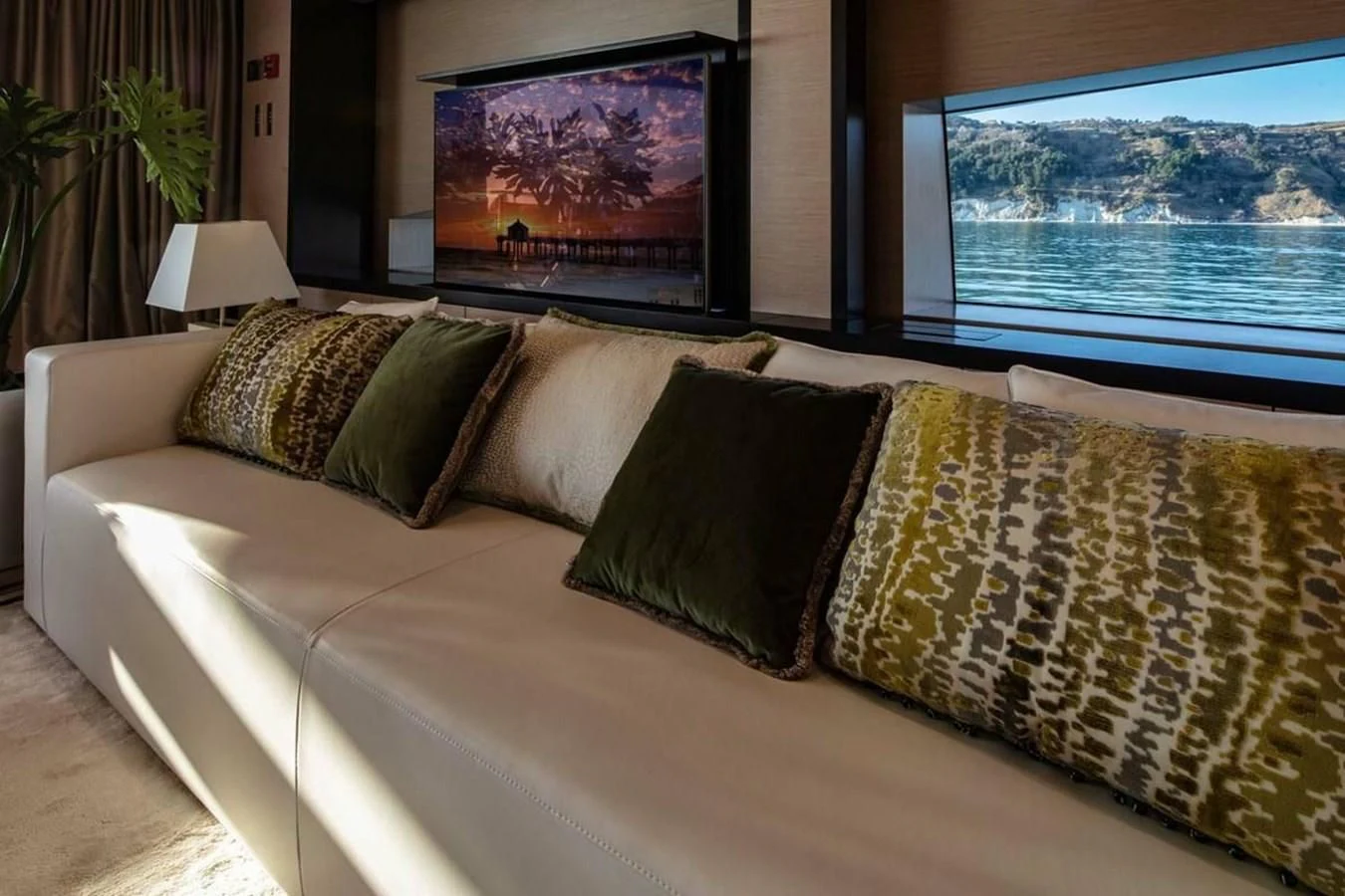 a couch with pillows aboard AGORA III Yacht for Sale