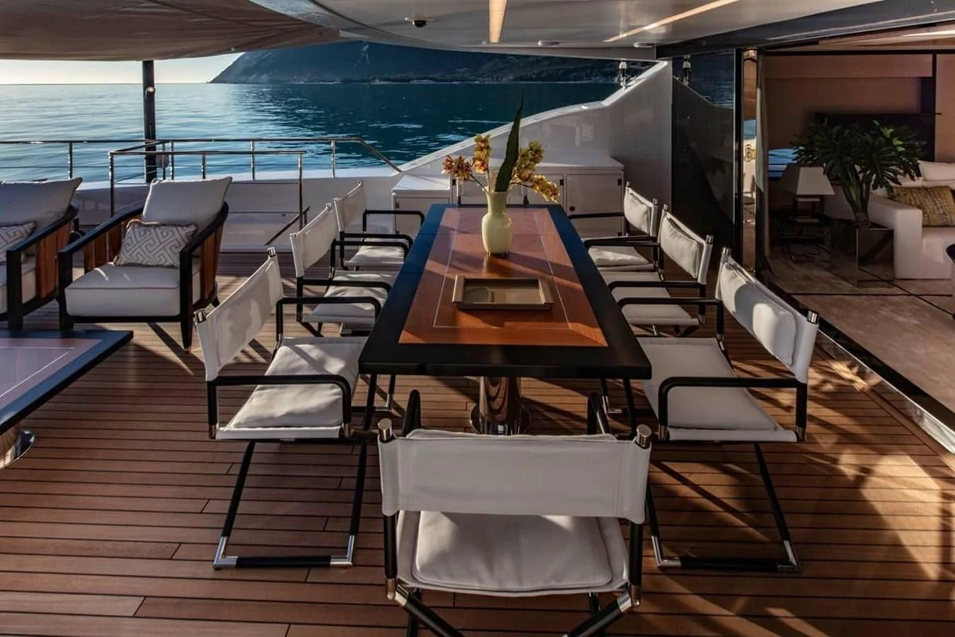 a room with a table and chairs aboard AGORA III Yacht for Sale