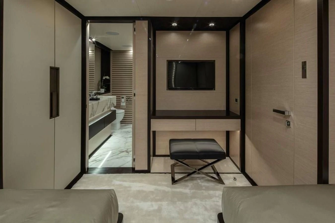 a room with a tv and a couch aboard AGORA III Yacht for Sale