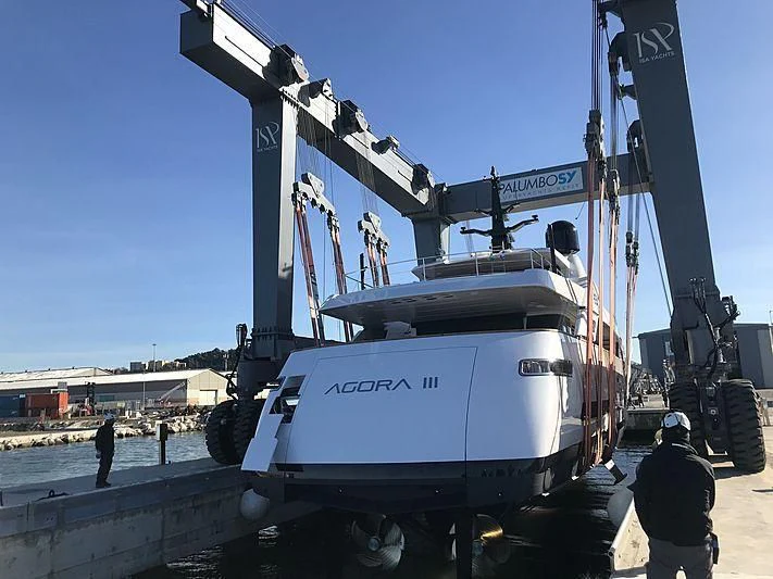 a large white truck with a large crane on the back aboard AGORA III Yacht for Sale